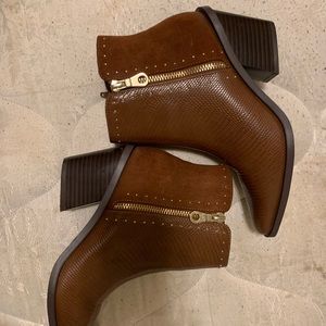 Barely worn Shoe Dazzle wedged boots. Shiny leather and still in great condition